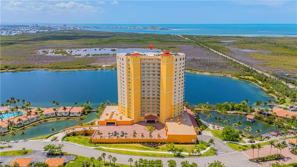 Bird's eye view of a large body of water and apartment complex