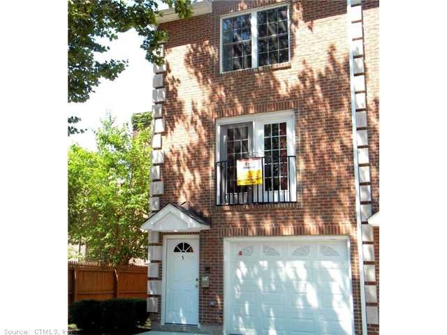 Facade/Exterior Front. Townhouse in the Spring