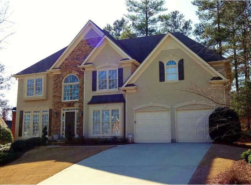 Exterior Front. Executive, hard coat stucco home o
