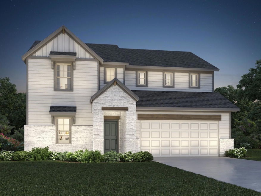 View of front of property featuring stone siding,