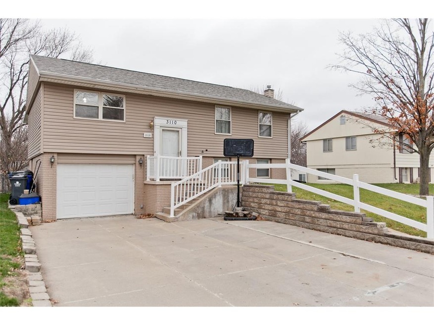 Front exterior with oversized driveway, room to pa