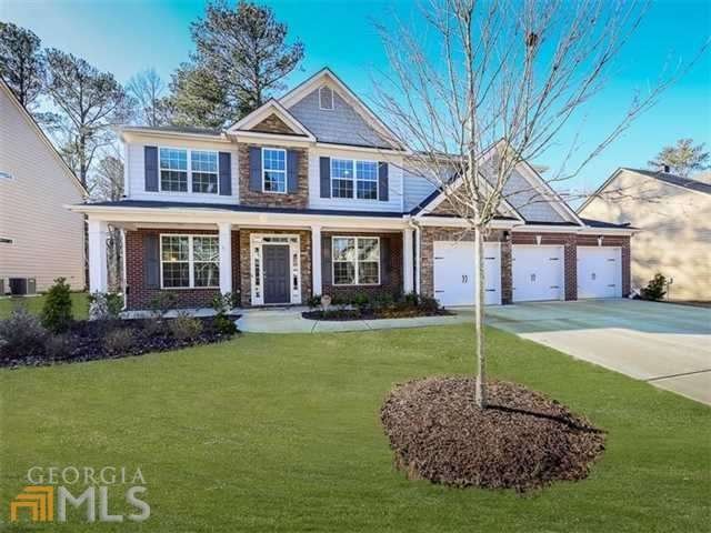 Beautifully decorated exterior with Brick, Stacked
