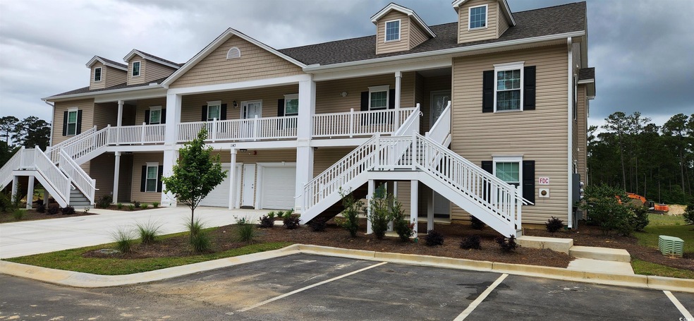 View of front of property featuring uncovered park