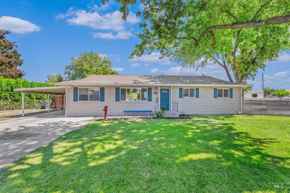 Ranch-style home with concrete driveway and an attached carport