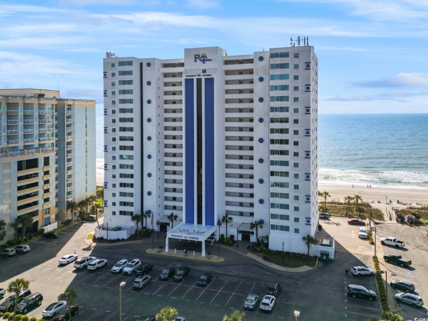 View of property with uncovered parking, a view of