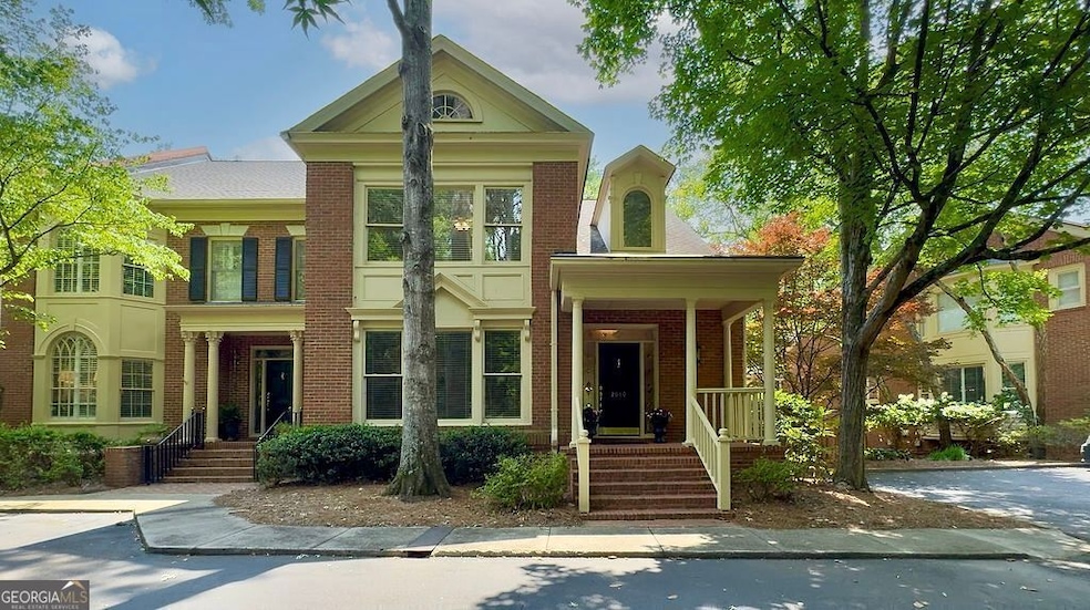 Charming end unit with welcoming front porch in sought after Wynfield Gables, a gated community along the banks of the Chattahoochee River in Roswell.