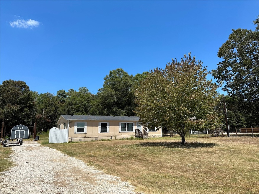 Home set back on front acre with beautiful front lawn