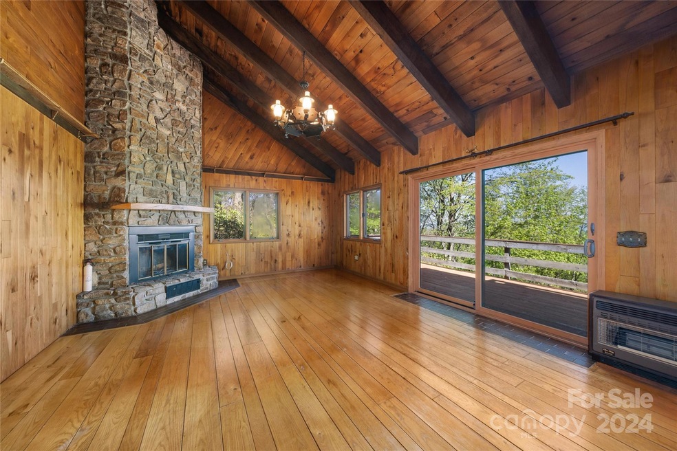 Panoramic Views from the Soaring Great Room with Stone Fireplace