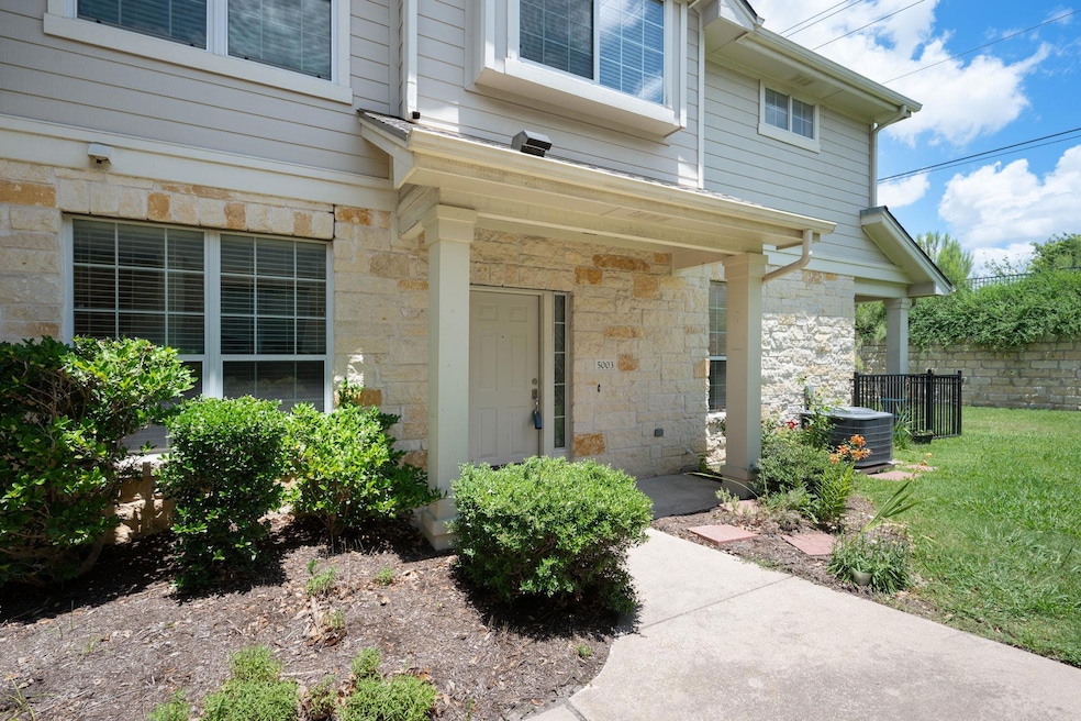 Doorway to property featuring stone siding