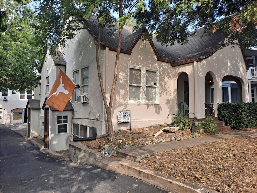 View of front of property featuring stucco siding