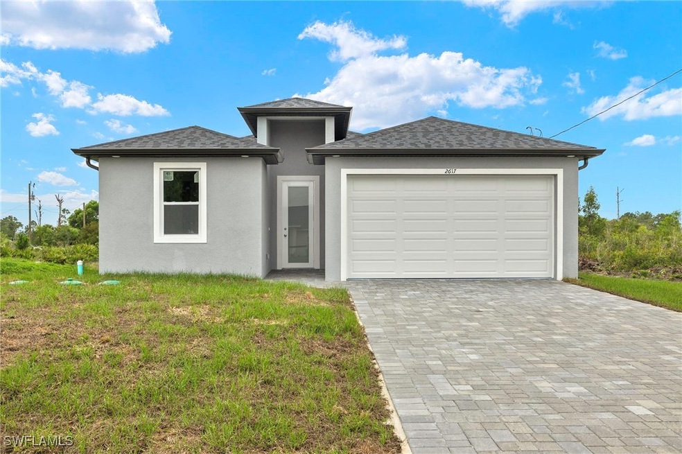 View of front of property featuring stucco siding,