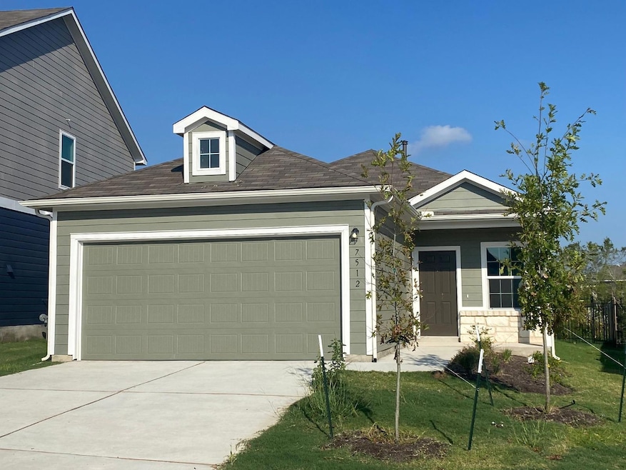 View of front of home featuring an attached garag