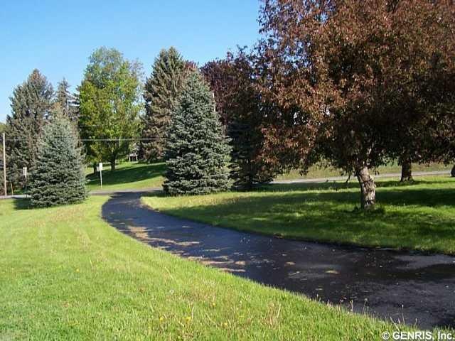 Exterior Front Circular Blacktop Drive