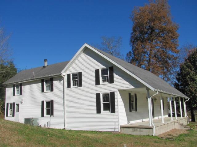 You will need multiple comfortable rocking chairs and porch swings on this lovely covered front porch so you can arrange several outdoor gathering spaces for friends and family.  