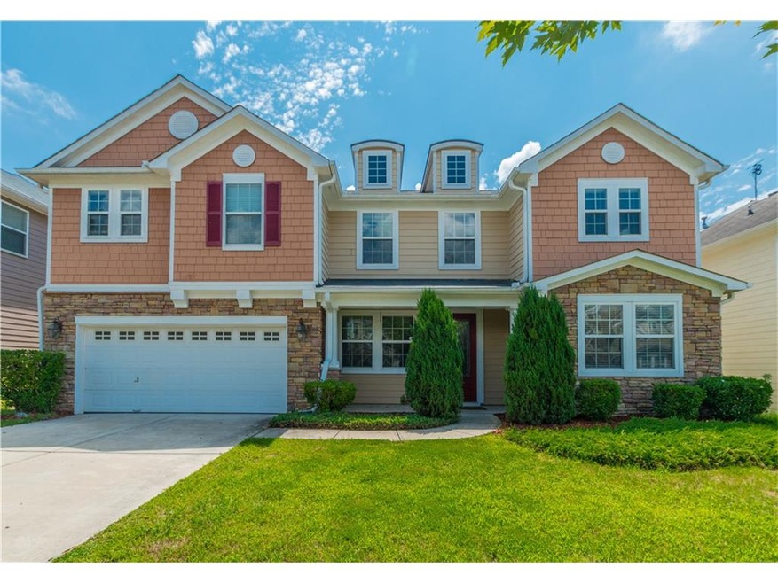 Great curb appeal on this Lanier Springs Beauty!