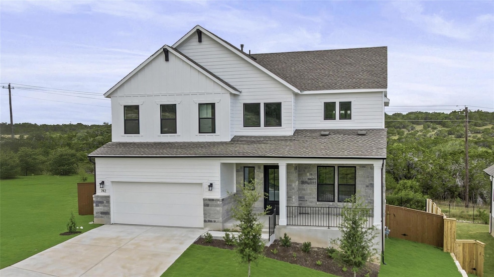 Modern inspired farmhouse with a porch, a shingle