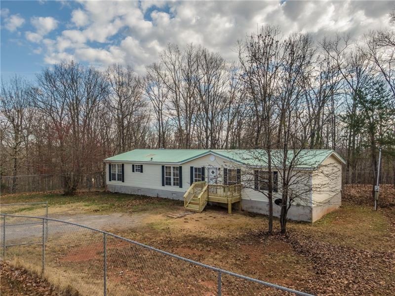 Mobile home on permanant foundation. Front and bac