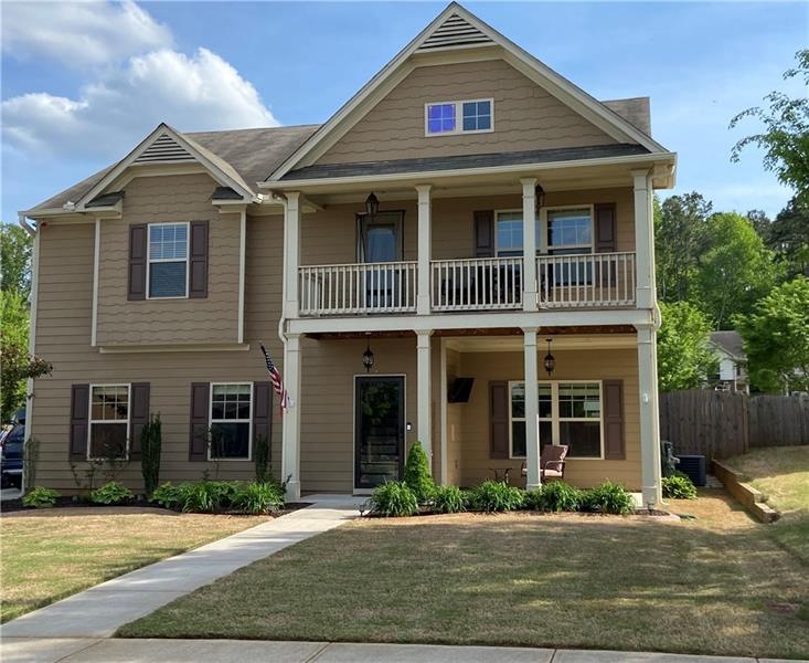 Beautiful entrance, level yard and driveway