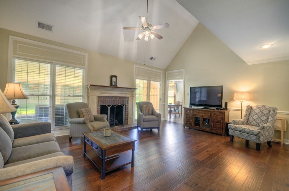 The Great Room features hand scraped hardwood floo