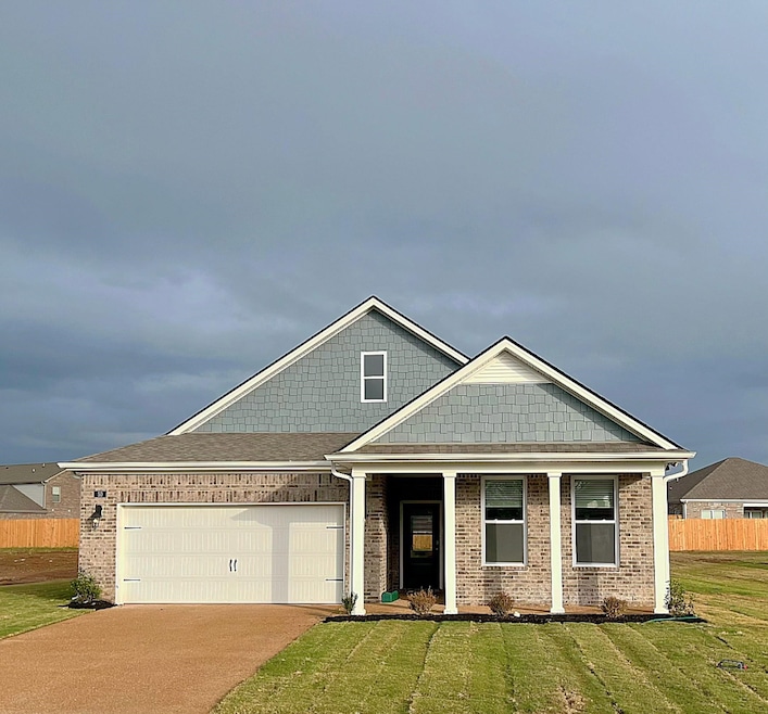 Craftsman-style house featuring a garage and a fro