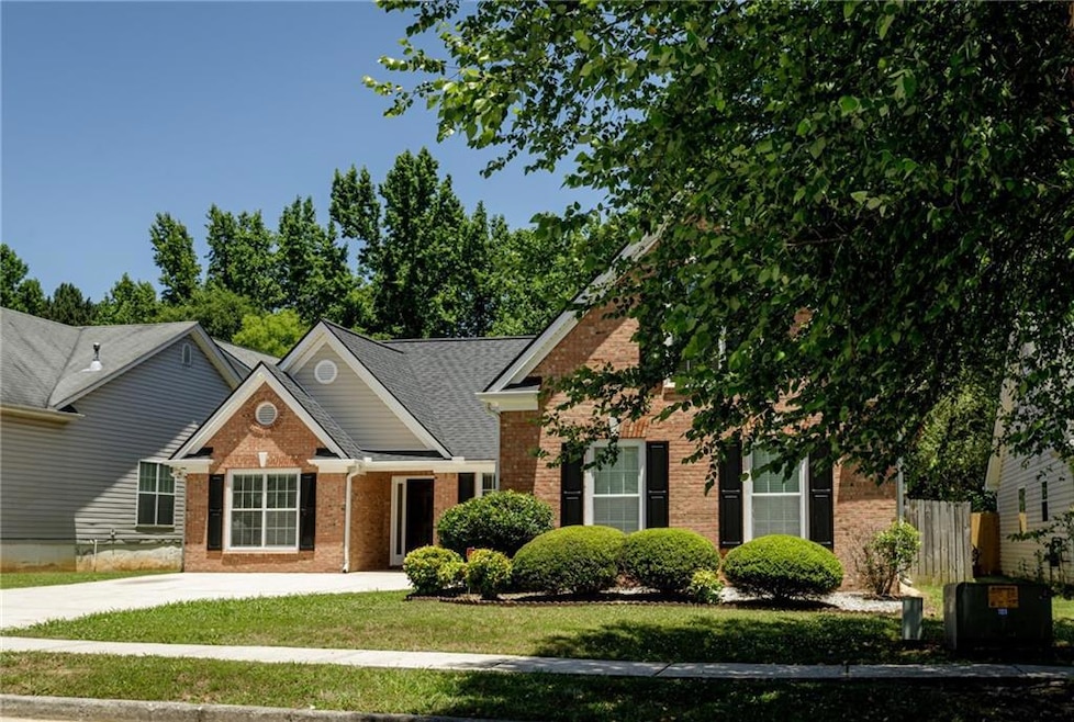 View of front of home featuring central AC and a f