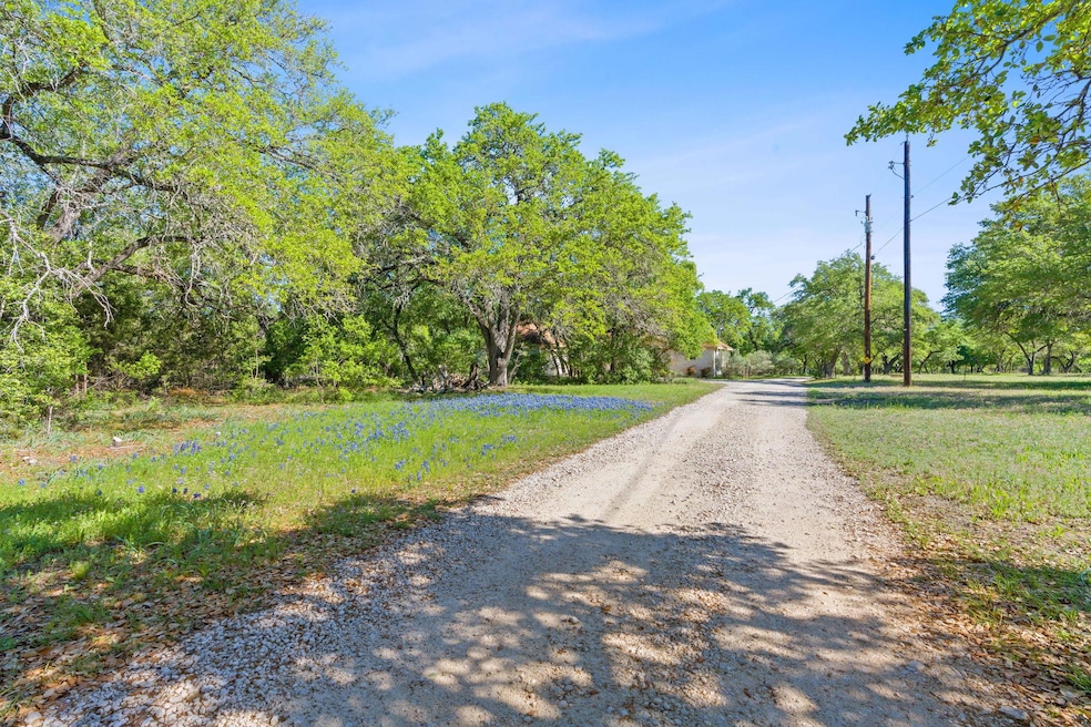 View of road with dirt driveway