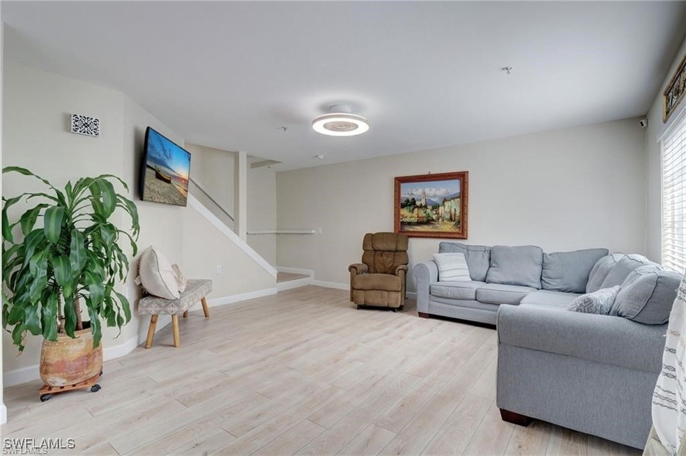 Living room with light hardwood / wood-style floor