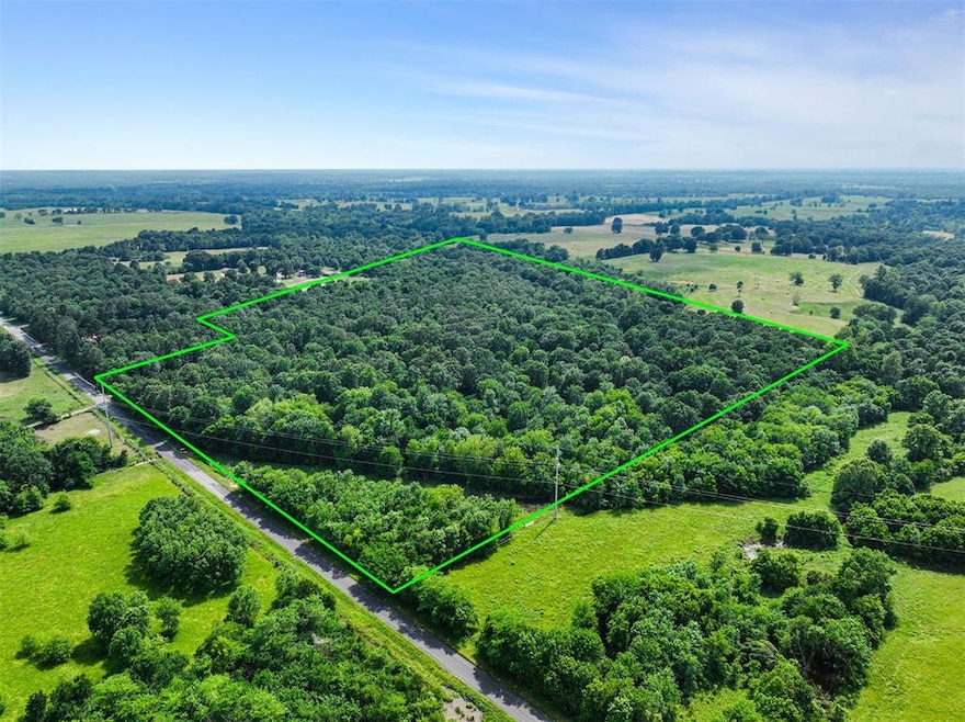 Aerial view of property and surrounding area with property boundaries highlighted