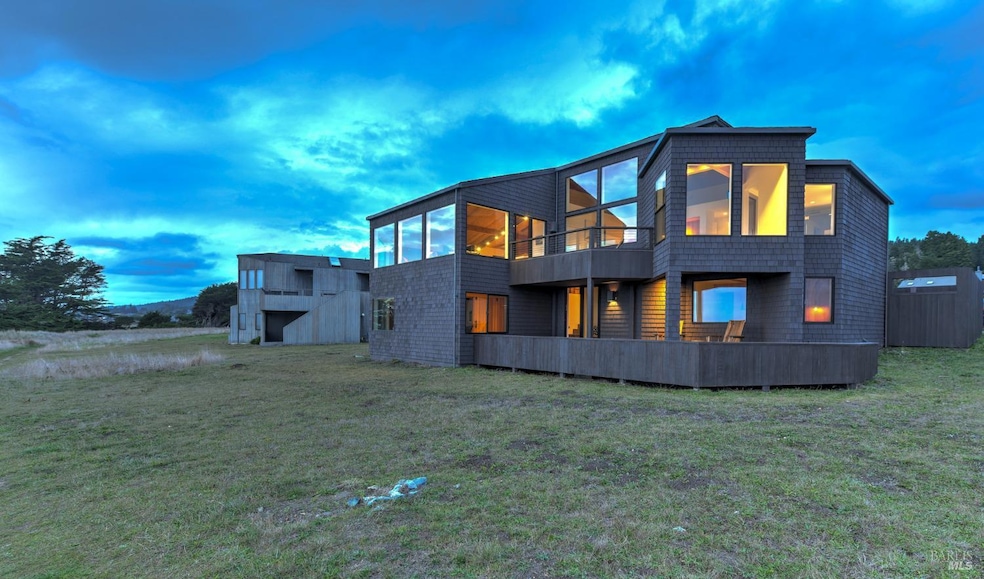 Exterior rear view at twilight.