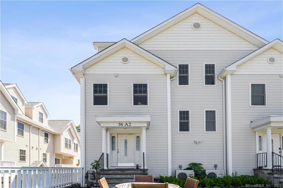 End unit with fully fenced front yard