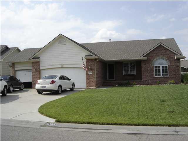 Front view of home with 3 car garage.