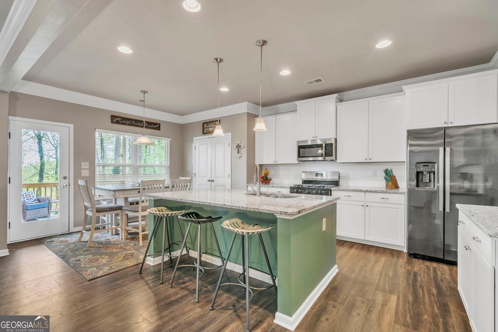 The kitchen is upgraded and has plenty of cabinetr