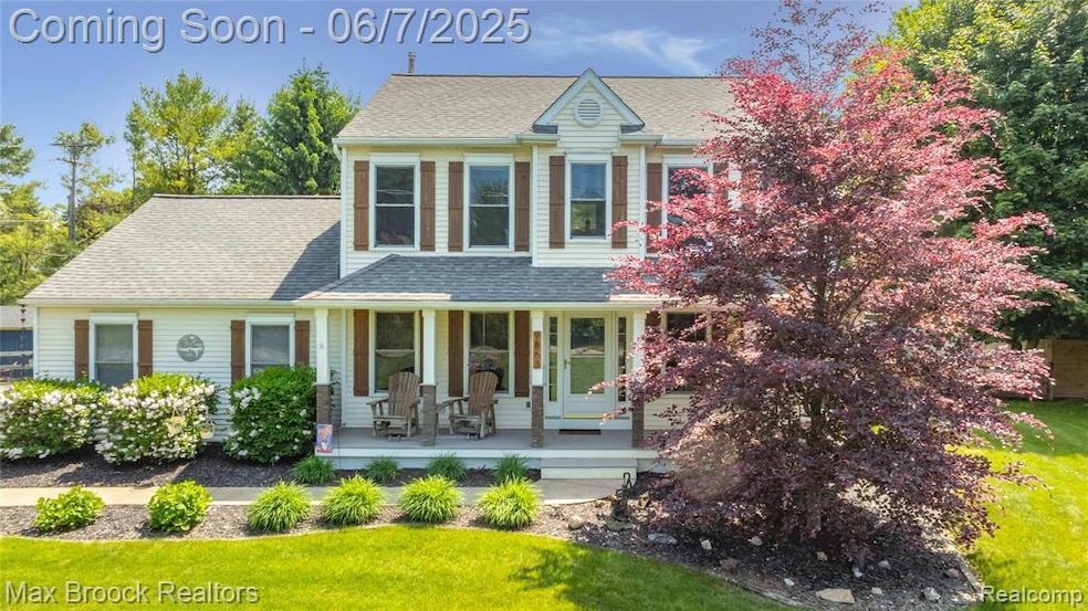 Front view. Pretty landscaping.