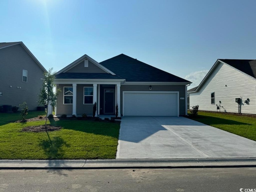 View of front of property with a garage and a fron