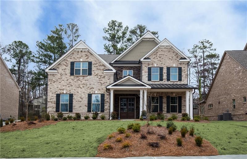 Large brick and stone family home with an inviting