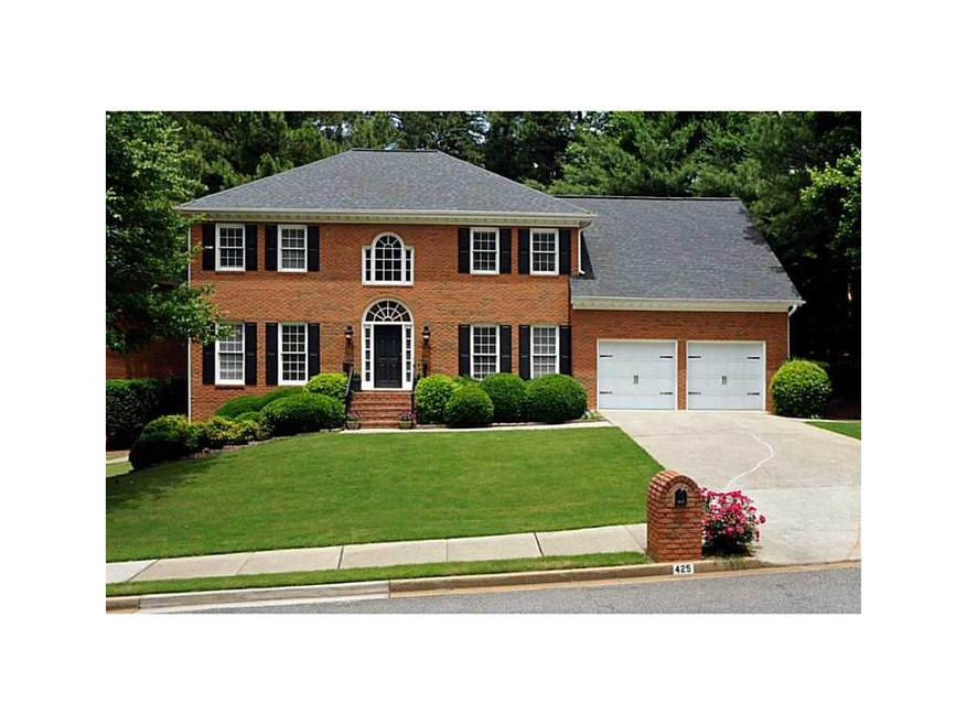 Exterior Front. Come check out this four-sided bri