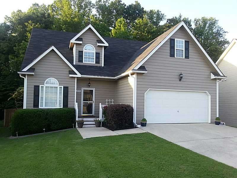 Exterior Front. Newly painted. Professional landsc