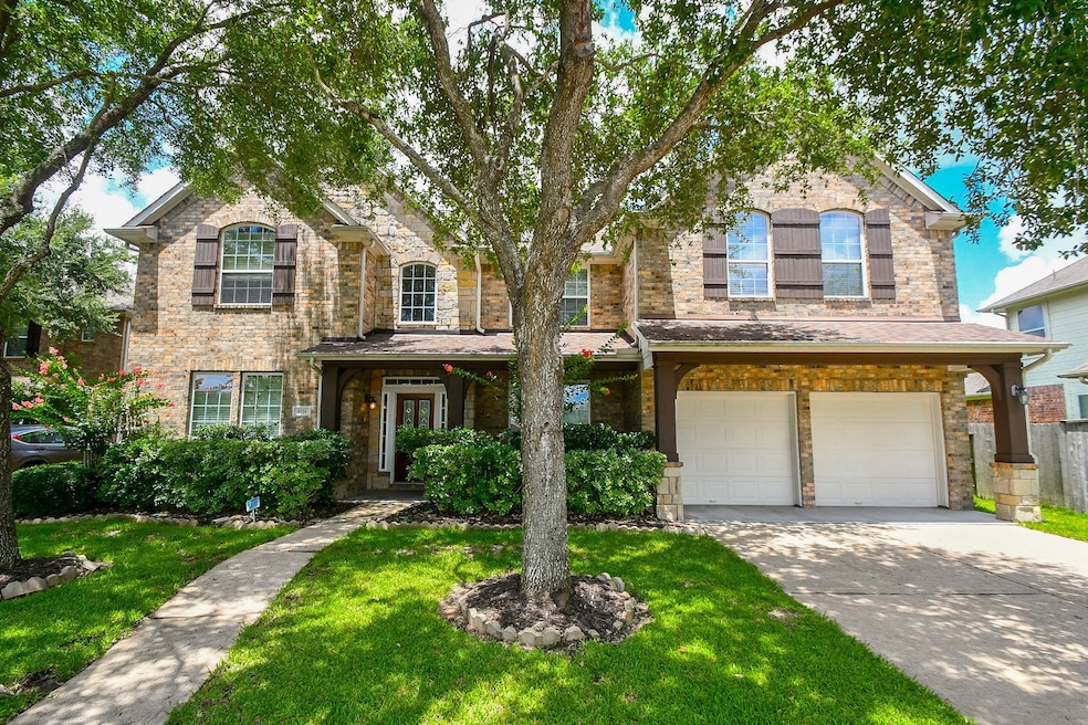 This charming two-story brick home features a welc