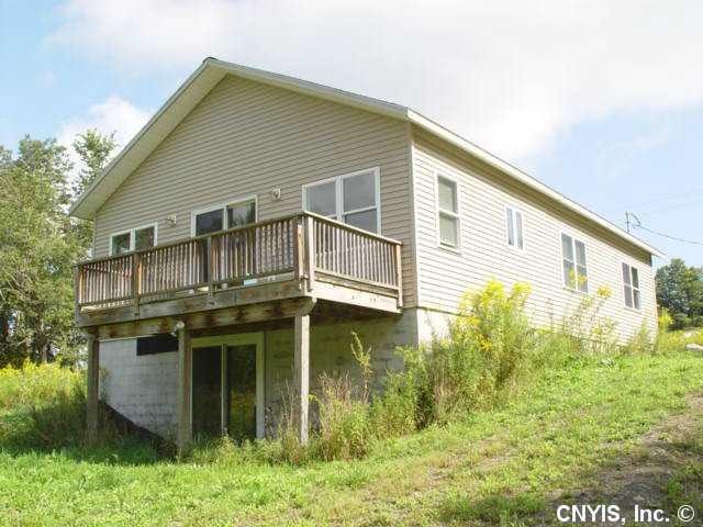 Exterior Back. Deck off great room overlooking nat