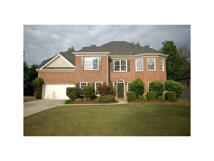 Exterior Front. Front Brick w/3 Sided Concrete Sid
