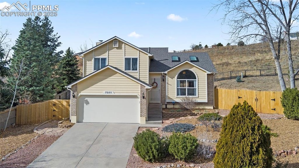 View of front of property featuring a garage