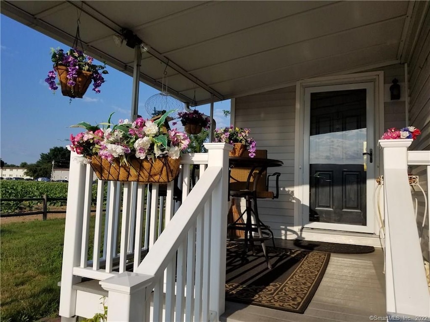 Covered front porch, perfect for enjoying a mornin