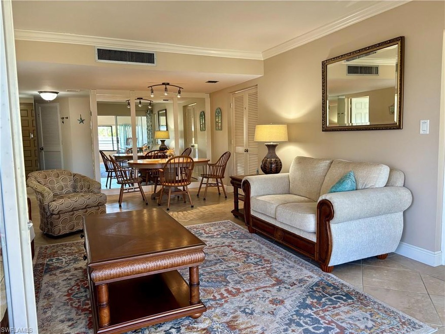 Living room featuring tile patterned floors and or