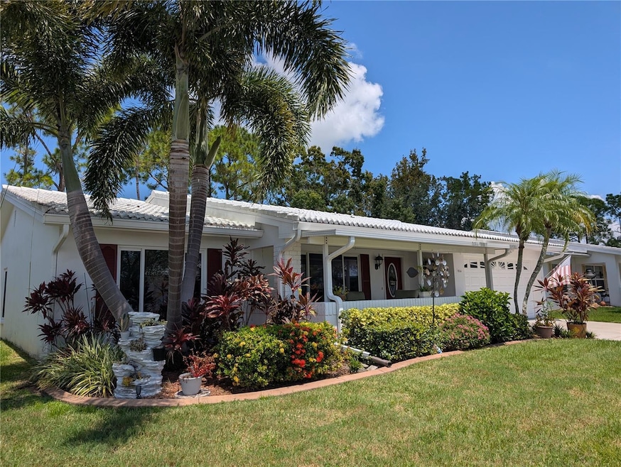 Stunning 2BR/2BA/2CG home with fireplace, covered front porch and back Lanai located in +55 community of Mainlands of Tamarac by the Gulf.