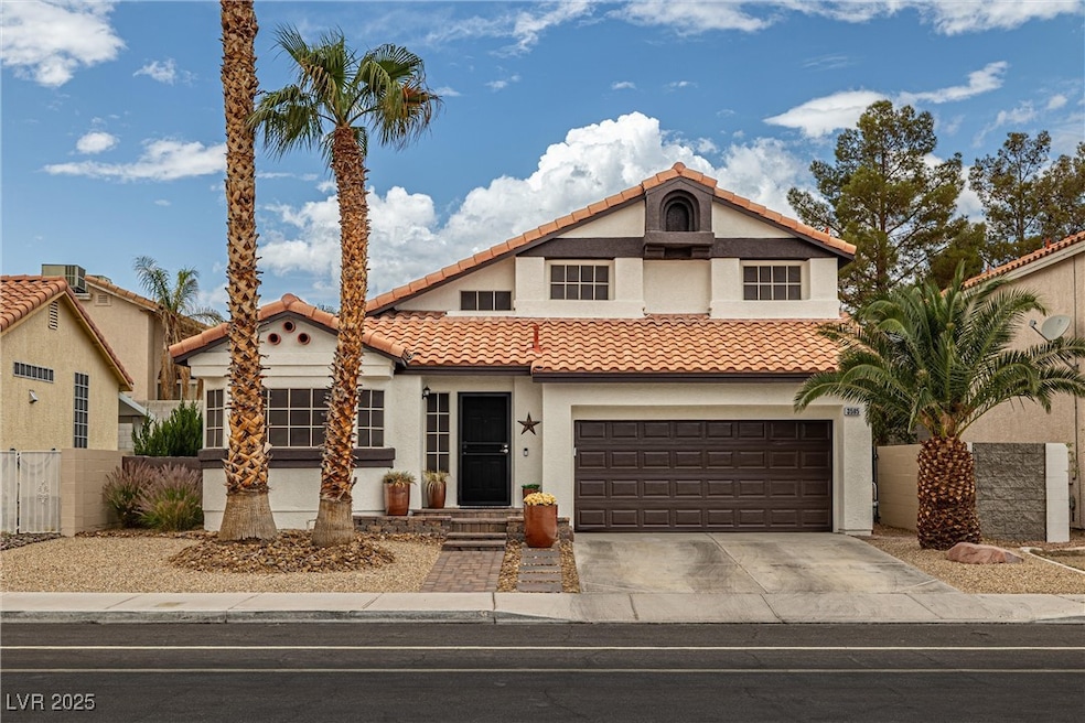 Mediterranean / spanish house featuring a tile roo