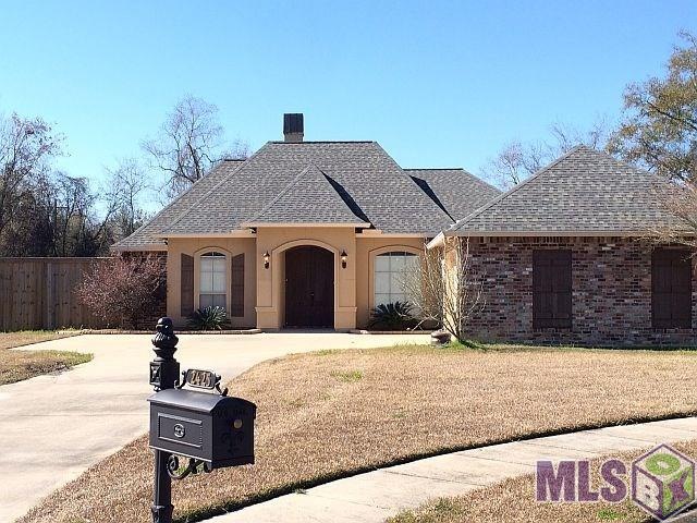 Acadian styled home located in cul de sac of priva