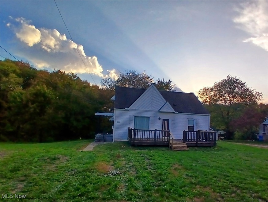 Front of house with a large deck.