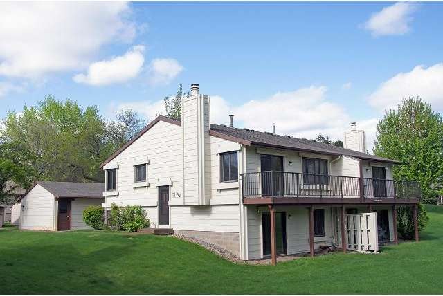 Townhouse is surrounded by a beautiful lawn--that 