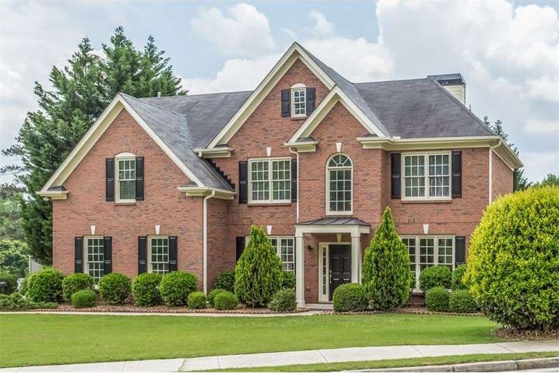 This traditional three-sided brick home is located