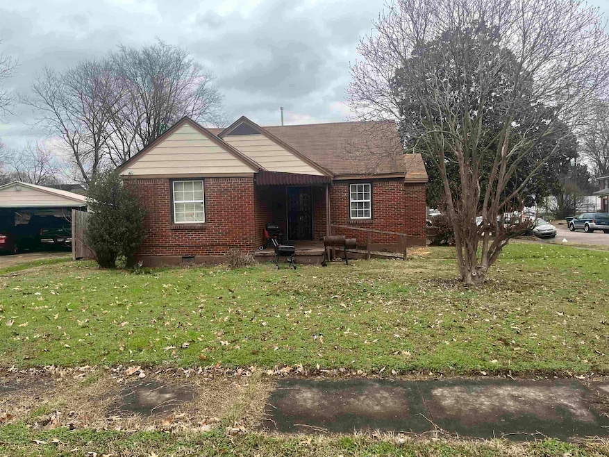 Single story home with brick siding, a front lawn, and crawl space